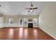 Spacious living room featuring hardwood floors, fireplace, and a stylish ceiling fan at 275 Creek View Ln, Acworth, GA 30102