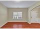 Living area with hardwood floors, neutral walls, view of the entrance door and a bright window at 275 Creek View Ln, Acworth, GA 30102