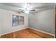 Bright bedroom with hardwood floors and a ceiling fan at 561 Congress Pkwy, Lawrenceville, GA 30044