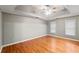 Spacious bedroom featuring hardwood floors and a ceiling fan at 561 Congress Pkwy, Lawrenceville, GA 30044