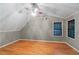 Spacious bedroom with hardwood floors and two windows at 561 Congress Pkwy, Lawrenceville, GA 30044