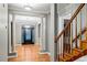 Bright entryway with hardwood floors, columns, and staircase at 561 Congress Pkwy, Lawrenceville, GA 30044