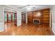 Living room with hardwood floors, built-in shelves, and fireplace at 561 Congress Pkwy, Lawrenceville, GA 30044