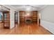 Living room with hardwood floors, built-in shelves, and fireplace at 561 Congress Pkwy, Lawrenceville, GA 30044