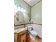 Powder room with granite vanity and decorative mirror at 561 Congress Pkwy, Lawrenceville, GA 30044