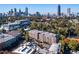 Aerial view of a modern apartment building with city skyline in the background at 640 Glen Iris Ne Dr # 515, Atlanta, GA 30308