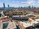 Striking aerial view of property with buildings and Atlanta skyline at The Reynolds in Atlanta, Georgia at 640 Glen Iris Ne Dr # 515, Atlanta, GA 30308