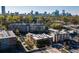 Scenic aerial view of community with trees, skyline, and neighborhood streets at The Reynolds in Atlanta, Georgia at 640 Glen Iris Ne Dr # 515, Atlanta, GA 30308