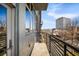 Balcony overlooking city buildings with black metal railing at 640 Glen Iris Ne Dr # 515, Atlanta, GA 30308