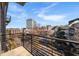 Balcony overlooking city buildings and street with black metal railing at 640 Glen Iris Ne Dr # 515, Atlanta, GA 30308