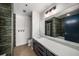 Modern bathroom featuring a double vanity and oversized mirror at 640 Glen Iris Ne Dr # 515, Atlanta, GA 30308