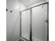 Contemporary bathroom with a glass-enclosed shower and white tiled walls at 640 Glen Iris Ne Dr # 515, Atlanta, GA 30308