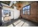 Bedroom with brick accent wall and modern light fixture at 640 Glen Iris Ne Dr # 515, Atlanta, GA 30308