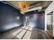 Bedroom with dark accent wall and modern light fixture at 640 Glen Iris Ne Dr # 515, Atlanta, GA 30308