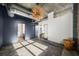 Spacious bedroom with dark accent wall and modern light fixture at 640 Glen Iris Ne Dr # 515, Atlanta, GA 30308