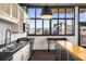 Bright kitchen featuring stainless steel appliances and a large window with neighborhood views at 640 Glen Iris Ne Dr # 515, Atlanta, GA 30308