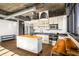 Modern kitchen featuring stainless steel appliances, a kitchen island, and industrial style lighting and exposed ductwork at 640 Glen Iris Ne Dr # 515, Atlanta, GA 30308