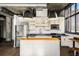Modern kitchen featuring stainless steel appliances, a kitchen island, and industrial style lighting and exposed ductwork at 640 Glen Iris Ne Dr # 515, Atlanta, GA 30308