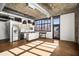 Open concept living space with stainless steel appliances, island, and exposed ductwork at 640 Glen Iris Ne Dr # 515, Atlanta, GA 30308