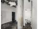 Unique living room featuring concrete pillar, black door, and an open doorway at 640 Glen Iris Ne Dr # 515, Atlanta, GA 30308