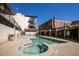 Outdoor swimming pool area with clear water and surrounding buildings at The Reynolds in Atlanta, Georgia at 640 Glen Iris Ne Dr # 515, Atlanta, GA 30308