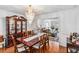 Formal dining room featuring a chandelier and hardwood floors at 7483 Pleasant Hill Rd, Lithonia, GA 30058