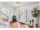 Bright entryway with hardwood floors and decorative accents at 7483 Pleasant Hill Rd, Lithonia, GA 30058