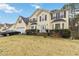 Two-story house with attached garage and manicured lawn at 7483 Pleasant Hill Rd, Lithonia, GA 30058