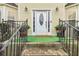 White front door with glass accents and black railings at 7483 Pleasant Hill Rd, Lithonia, GA 30058