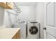 Convenient laundry room with washer, dryer, and storage at 7483 Pleasant Hill Rd, Lithonia, GA 30058