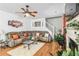 Spacious living room with hardwood floors and a large sectional sofa at 7483 Pleasant Hill Rd, Lithonia, GA 30058