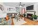 Cozy living room features a fireplace and hardwood floors at 7483 Pleasant Hill Rd, Lithonia, GA 30058