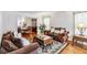 Spacious living room with hardwood floors and comfortable furniture at 7483 Pleasant Hill Rd, Lithonia, GA 30058