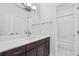 Bathroom vanity featuring a white countertop and dark wood cabinets at 2224 Snug Ne Hbr, Marietta, GA 30066