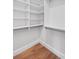 Walk-in closet with new shelving and wood floors at 2224 Snug Ne Hbr, Marietta, GA 30066