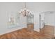 Bright dining room with hardwood floors, chandelier, and a view to another living space at 2224 Snug Ne Hbr, Marietta, GA 30066