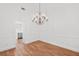 Dining room with hardwood floors and a stylish chandelier, perfect for entertaining at 2224 Snug Ne Hbr, Marietta, GA 30066