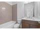 Bathroom with a bathtub and shower combination, stylish fixtures, and single sink vanity at 2531 High Brow St # 41, Duluth, GA 30096
