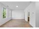 Bedroom featuring wood floors, white walls, natural lighting, and an attached bathroom at 2531 High Brow St # 41, Duluth, GA 30096