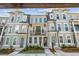 Charming townhome featuring a brick facade, balcony, and well-maintained landscaping at 2531 High Brow St # 41, Duluth, GA 30096