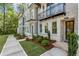 Beautiful townhouse exterior with manicured lawn and walkway leading to entrance at 2531 High Brow St # 41, Duluth, GA 30096