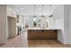 Modern kitchen featuring stainless steel appliances, quartz countertops, and wood grain vinyl flooring at 2531 High Brow St # 41, Duluth, GA 30096
