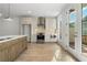 Modern kitchen featuring stainless steel appliances, island, and access to the deck at 2531 High Brow St # 41, Duluth, GA 30096