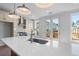 Stylish kitchen with quartz island, modern appliances, and access to outdoor deck at 2531 High Brow St # 41, Duluth, GA 30096