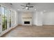 Bright living room with stone fireplace and French doors to balcony at 2531 High Brow St # 41, Duluth, GA 30096