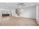 Bright living area with an open floor plan featuring hardwood floors and staircase at 2531 High Brow St # 41, Duluth, GA 30096