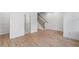 Open-concept space with a staircase, wood floors, and a doorway to a closet space at 2531 High Brow St # 41, Duluth, GA 30096