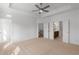 Large main bedroom featuring tray ceiling, ceiling fan, and bathroom/closet entries at 2531 High Brow St # 41, Duluth, GA 30096