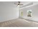 Serene main bedroom with tray ceiling, ceiling fan, and soft natural light at 2531 High Brow St # 41, Duluth, GA 30096