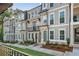 Charming townhome exterior with manicured landscaping, brick accents, and neutral colors at 2531 High Brow St # 41, Duluth, GA 30096
